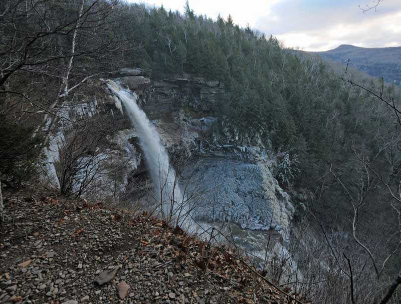 side view of Kaaterskill Falls from the rim of lake creek ravine in the catskill mountains in the winter